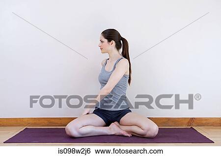 Woman stretching during yoga View Large Photo Image Stock Photograph - Woman stretching during yoga. Fotosearch
