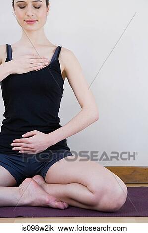 Women breathing deeply, touching chest and abdomen View Large Photo Image Stock Image - Women breathing deeply, touching chest and abdomen. Fotosearch