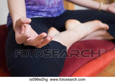 Women in lotus position during yoga View Large Photo Image Stock Image - Women in lotus position during yoga. Fotosearch