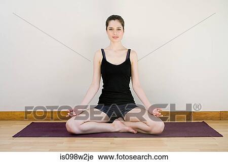 Women in lotus position during yoga View Large Photo Image Stock Image - Women in lotus position during yoga. Fotosearch