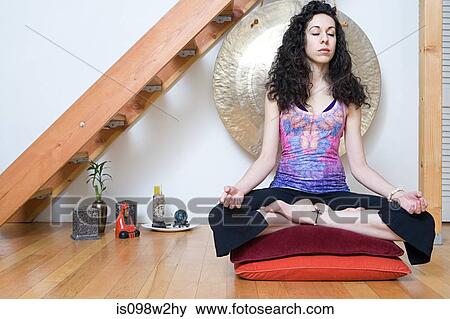 Women in lotus position during yoga View Large Photo Image Stock Photo - Women in lotus position during yoga. Fotosearch