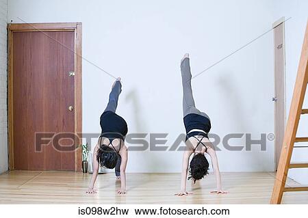 Women practicing yoga View Large Photo Image Stock Photo - Women practicing yoga. Fotosearch
