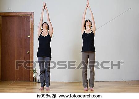 Women stretching during yoga View Large Photo Image Stock Image - Women stretching during yoga. Fotosearch