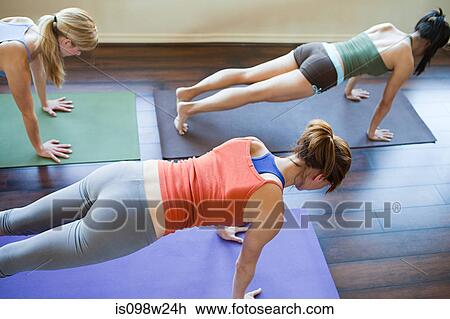 Three woman doing yoga class View Large Photo Image Stock Image - Three woman doing yoga class. Fotosearch