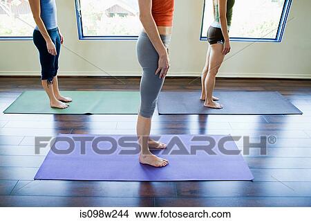 Three women doing yoga class View Large Photo Image Picture - Three women doing yoga class. Fotosearch