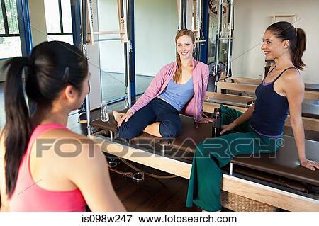 Three women talking in gym View Large Photo Image Stock Photo - Three women talking in gym. Fotosearch