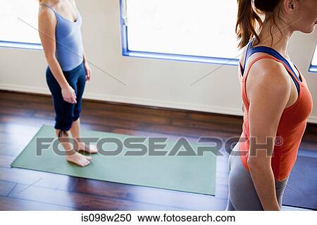 Two woman doing yoga class View Large Photo Image Stock Image - Two woman doing yoga class. Fotosearch