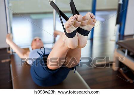 Woman doing pilates in gym View Large Photo Image Stock Image - Woman doing pilates in gym. Fotosearch
