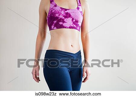 Woman doing pilates, mid section View Large Photo Image Stock Photo - Woman doing pilates, mid section. Fotosearch