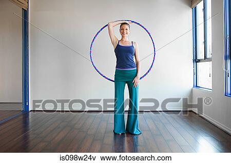 Woman holding plastic hoop for pilates View Large Photo Image Stock Photo - Woman holding plastic hoop for pilates. Fotosearch