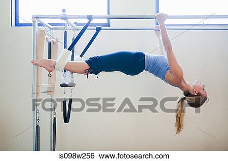Women doing pilates View Large Photo Image Stock Photograph - Women doing pilates. Fotosearch