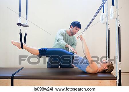Women doing pilates with instructor View Large Photo Image Stock Image - Women doing pilates with instructor. Fotosearch