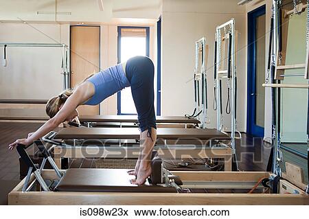 Young woman doing pilates View Large Photo Image Stock Photo - Young woman doing pilates. Fotosearch
