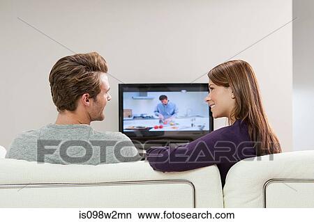 Picture - Couple watching television. Fotosearch
