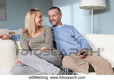 Couple watching television View Large Photo Image Stock Image - Couple watching television. Fotosearch
