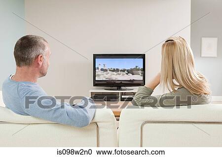 Stock Image - Couple watching television. Fotosearch