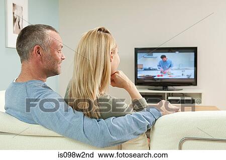 Stock Image - Couple watching television. Fotosearch