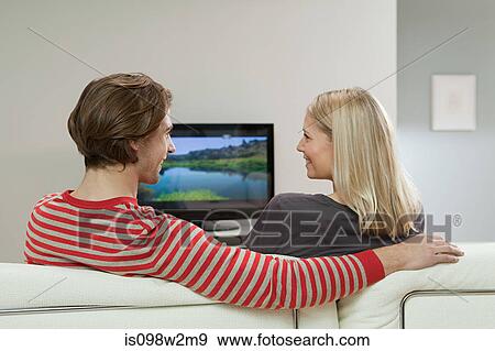 Couple watching television View Large Photo Image Stock Photo - Couple watching television. Fotosearch