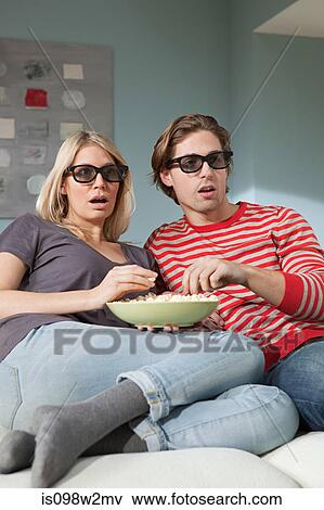 Stock Photo - Couple watching television. Fotosearch