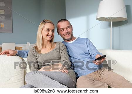 Stock Photo - Couple watching television. Fotosearch