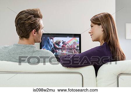 Couple watching television View Large Photo Image Stock Photograph - Couple watching television. Fotosearch