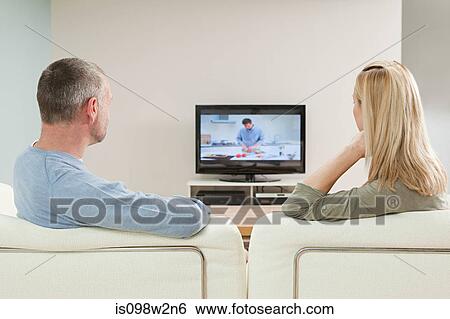 Couple watching television View Large Photo Image Stock Photograph - Couple watching television. Fotosearch