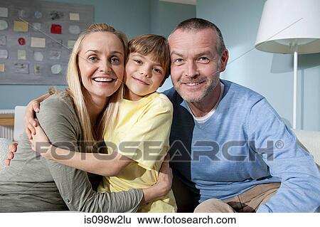 Stock Photograph - Family portrait in living room. Fotosearch
