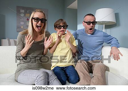 Family watching 3d movie at home View Large Photo Image Stock Image - Family watching 3d movie at home. Fotosearch