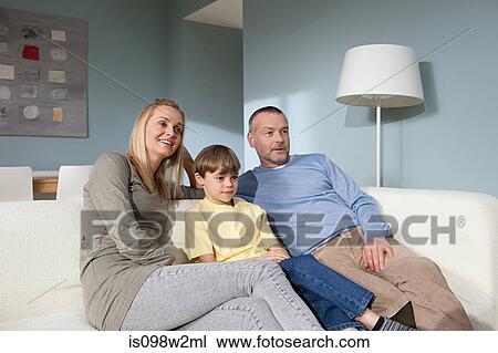 Family watching television View Large Photo Image Stock Image - Family watching television. Fotosearch