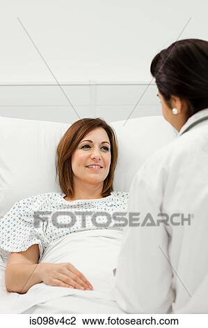Stock Image - Female patient with doctor. Fotosearch