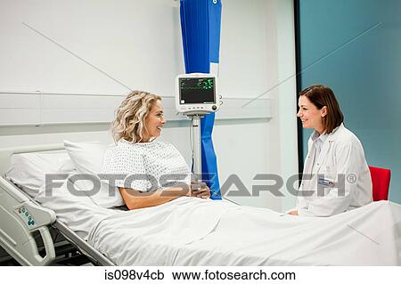 Stock Image - Female patient with doctor. Fotosearch