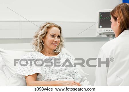 Female patient with doctor View Large Photo Image Stock Image - Female patient with doctor. Fotosearch