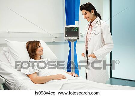 Female patient with doctor View Large Photo Image Stock Image - Female patient with doctor. Fotosearch