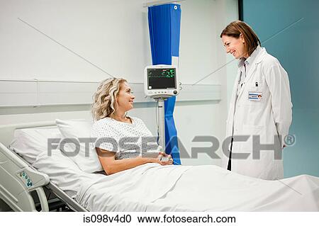 Stock Image - Female patient with doctor. Fotosearch