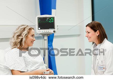 Female patient with doctor View Large Photo Image Stock Image - Female patient with doctor. Fotosearch