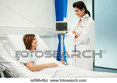 Female patient with doctor View Large Photo Image Stock Photo - Female patient with doctor. Fotosearch