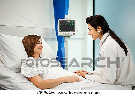 Female patient with doctor View Large Photo Image Stock Photo - Female patient with doctor. Fotosearch