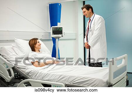 Female patient with doctor View Large Photo Image Stock Photo - Female patient with doctor. Fotosearch