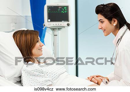 Female patient with doctor View Large Photo Image Stock Photo - Female patient with doctor. Fotosearch