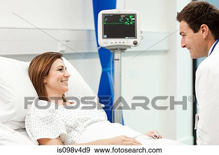 Stock Photo - Female patient with doctor. Fotosearch