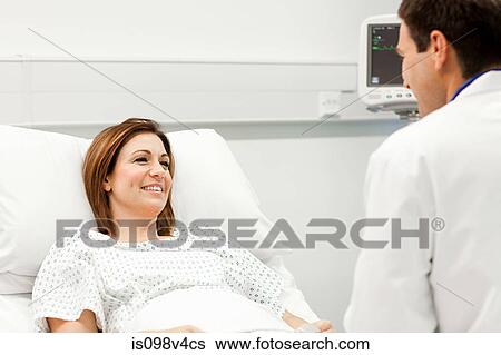 Stock Photograph - Female patient with doctor. Fotosearch