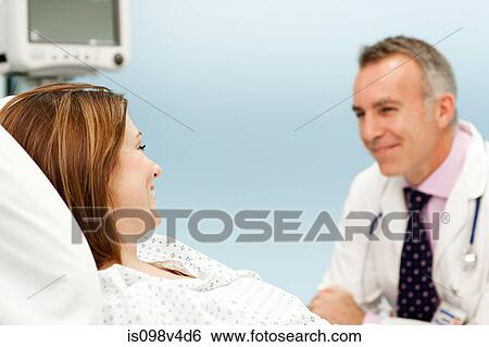 Stock Photograph - Female patient with doctor. Fotosearch