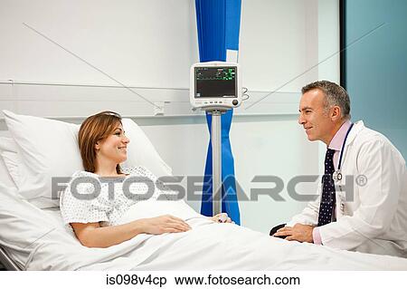 Female patient with doctor View Large Photo Image Stock Photography - Female patient with doctor. Fotosearch