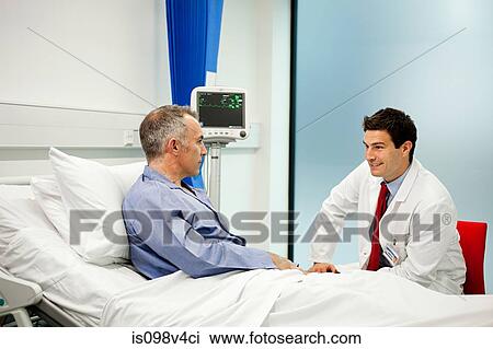 Male patient with doctor View Large Photo Image Stock Image - Male patient with doctor. Fotosearch