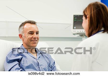 Male patient with doctor View Large Photo Image Stock Image - Male patient with doctor. Fotosearch
