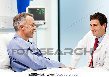 Male patient with doctor View Large Photo Image Stock Photo - Male patient with doctor. Fotosearch