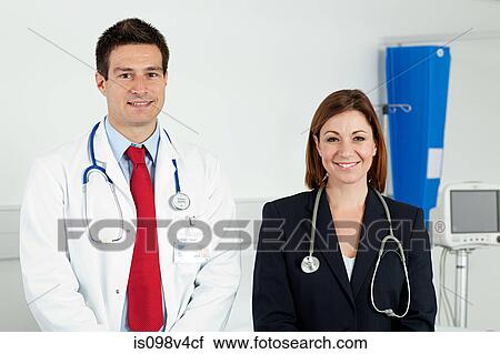 Portrait of male and female doctor View Large Photo Image Stock Image - Portrait of male and female doctor. Fotosearch
