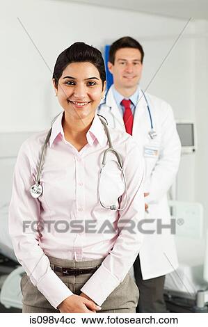 Stock Image - Portrait of male and female doctors. Fotosearch