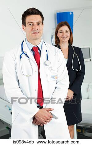 Stock Image - Portrait of male and female doctors. Fotosearch