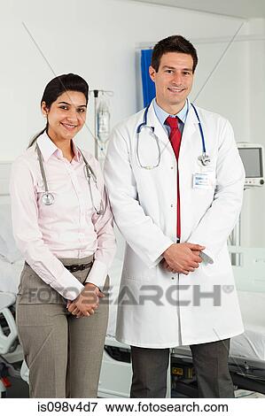 Portrait of male and female doctors View Large Photo Image Stock Photo - Portrait of male and female doctors. Fotosearch